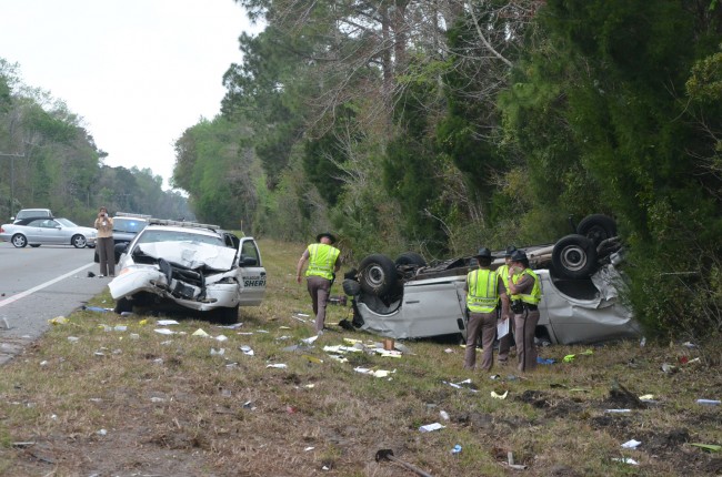 The Flagler deputy's cruiser rear-ended the van on SR100. Click on the image for larger view. (© FlaglerLive)