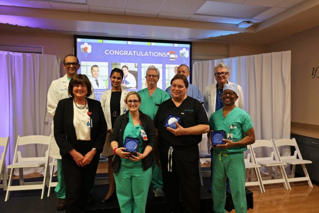 Dr. Teresa Herbert, Chief Medical Officer, AdventHealth Flagler/St. Johns market, Dr. Jessica Marshall, General Surgery/Robotics, Dr. Steven Brown, Gynecology/Robotic Surgeon, Dr. Tony Highshaw, General Surgery/Robotics Second Row: Dr. Abubaker Ali, Advance GI Surgery/Robotics, Dr. Tanam Ahmed, Primary Care Physician, Dr. Terrence Regan, Urology, Dr. Stephen “Blue” Coltharp, Emergency Medicine, Dr. Eric Gershman, Oncology