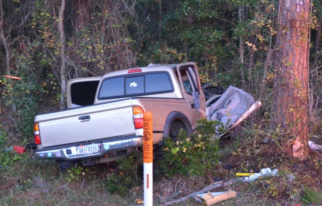 The driver lost control of his Toyota pick-up, which veered into the woods and struck a tree. Click on the image for larger view. (© FlaglerLive)