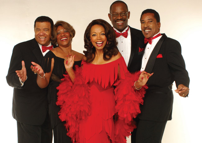 Florence LaRue and the current members of the 5th Dimension. 