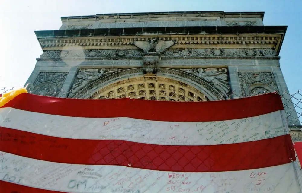 In Washington Square Park in Manhattan, an American flag turned emotional message board in the days after the 9/11 attacks. (© Pierre Tristam/FlaglerLive)