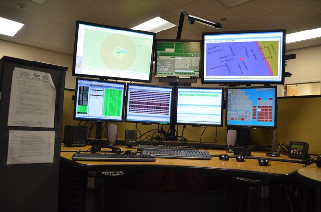 Flagler County's 911 dispatchers, who face a wall of computer screens,  can now quickly pinpoint where cell calls originate. Cell calls are the majority of calls to the 911 center. (© FlaglerLive)