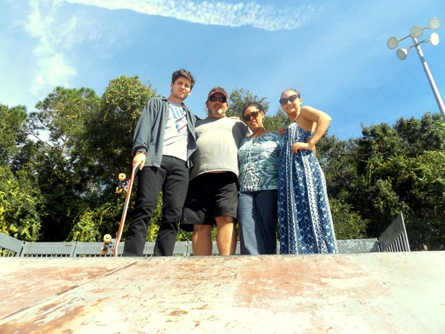 Family and friends of the late AJ Fernandez are hosting the Remembering AJ Skate Competition on Nov. 8 at Wadsworth Park in Flagler Beach. Pictured at the park's skateboarding complex are, from left: friend Joey Strople, AJ's stepfather Bill Raszl, AJ's mother Yvette Ruiz-Raszl, and friend and event organizer Carli Cipolla. Family and friends hope the benefit event not only will memorialize AJ but also bring awareness to schizophrenia and suicide prevention. All proceeds will benefit the Johns Hopkins Schizophrenia Center in Baltimore. (c FlaglerLive)