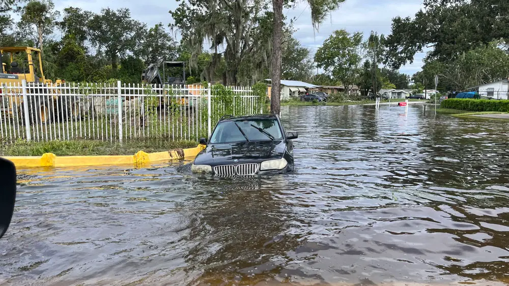 Picture of a submerged BMW in a street after Hurricane Ian. (New Smyrna Beach official Facebook page)