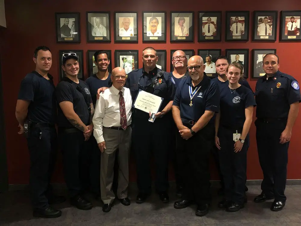 Flagler Chapter of the Sons of the American Revolution President Charles Hayes and Dr. Jeff Schaller, present the 2019 Fire Service Medal & Certificate to Palm Coast Fire Capt. James Neuenfeldt. Pictured is Deputy Chief Bradd Clark and Palm Coast firefighters.