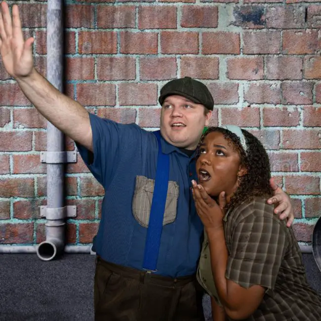  Alexander Loucks is Bobby Strong and Laniece Fagundes is Hope Cladwell in City Repertory Theatre’s production of the satirical musical “Urinetown.” (Mike Kitaif)