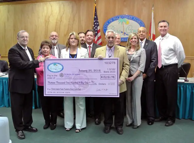 Members of the Palm Coast City Council and Florida Hospital Flagler's foundation at this morning's check ceremony. Click on the image for larger view. 