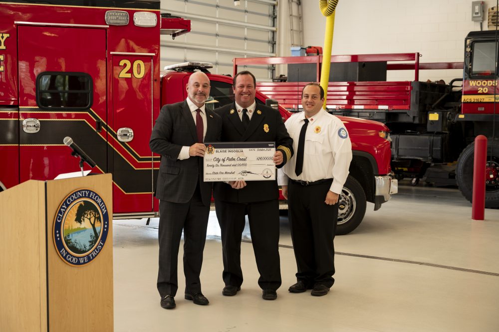Fire Chief Kyle Berryhill (middle) and Battalion Chief Patrick Juliano (right) accepting the Florida Firefighter Cancer Decontamination Grant Award. (Palm Coast)