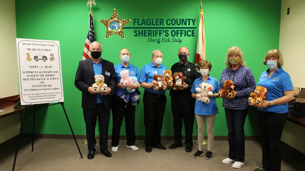 Members of the Kiwanis Club with Flagler County Sheriff Rick Staly and the Kiwanis's latest donation of stuffed bears. (FCSO)