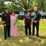 Sheriff Rick Staly and Chief Mark Strobridge with Detention Deputy First Class Paul Luciano's family at the fallen officers' memorial in Tallahassee today. (FCSO)