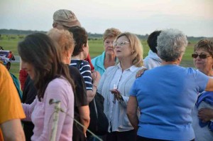 Marie-Louise Samuels-Parker, Mann's attorney (in the white shirt, center), chose to be with the church group immediately after witnessing the execution of the client she'd represented for 10 years. Click on the image for larger view. (c FlaglerLive)