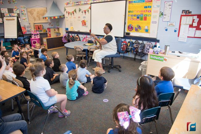 Dorothy Mayhue reads to students at Belle Terre Elementary during the school's annual African-American Read-In Thursday morning. (Flagler Schools)