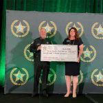 Sheriff Staly presenting the employee donation to the FSYR Executive VP Maria Knapp.