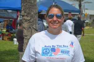 Rebecca Cappetta of the Coquina Coast Democratic Caucus organized the rally with Stephanie Capehart. (© FlaglerLive)