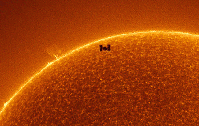The International Space Station crosses the sun in a July 15 image captured by Rainee Colacurcio and disseminated by NASA's Astronomy Picture of the Day. 