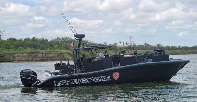 TX DPS/Highway Patrol boat on the Rio Grande River. Mexico in the background. Note the five .50 caliber machine guns and armor plating for protection from the drug cartels.
