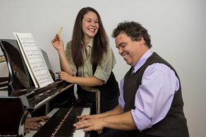 cutline: Beau Wade is Vernon and Angela Young is Sonia in the City Repertory Theatre production of the musical comedy “They’re Playing Our Song.” The play, with book by Neil Simon, lyrics by Carole Bayer Sager and music by Marvin Hamlisch, will be staged Jan. 10-19. Photo by Mike Kitaif