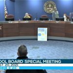 John Wilson, who opposes mask mandates, shouts at Sarasota County School Board chair and former state Rep. Shirley Brown (standing), who called a recess to clear the room of hecklers. (Sarasota County School Education Channel)