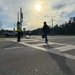 Crossing guard Yvonne Fertall at Rymfire Elementary last spring. The surging cost of crossing guards to the school district, even though the number of guards isn;t changing, raised questions among school board members, as did the rising cost of school deputies. (Flagler Schools)