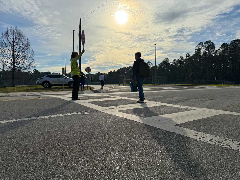 Crossing guard Yvonne Fertall at Rymfire Elementary last spring. The surging cost of crossing guards to the school district, even though the number of guards isn;t changing, raised questions among school board members, as did the rising cost of school deputies. (Flagler Schools)