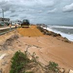 Hurricane Nicole carved out more segments of State Road A1A in the segment of shore that has been awaiting a dune-rebuilding project for years. That project has now yet again been delayed. (© FlaglerLive)