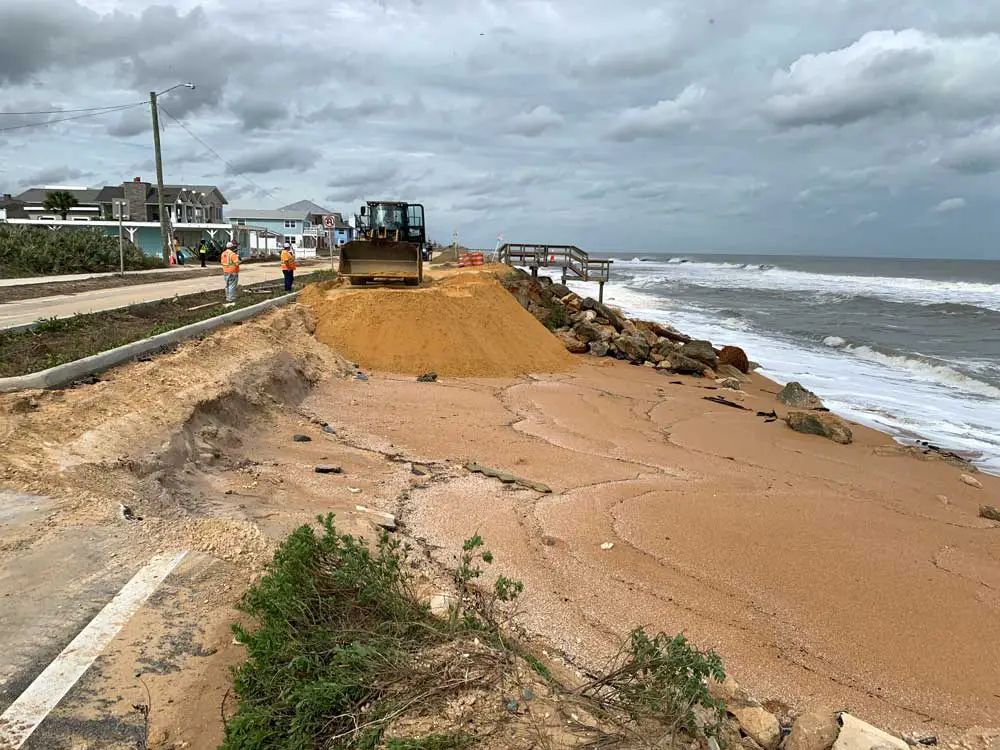 Hurricane Nicole carved out more segments of State Road A1A in the segment of shore that has been awaiting a dune-rebuilding project for years. That project has now yet again been delayed. (© FlaglerLive)