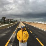 Flagler Beach City Manager Larry Newsom this afternoon on the median of the reconstructed State Road A1A, moments before it reopened to both northbound and southbound traffic for the first time in more than 300 days. (© FlaglerLive)