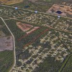 The Seminole Woods acreage, roughly delineated in red, is currently zoned greenbelt. The Palm Coast City Council approved its rezoning to residential, with a second reading later this month. (Google Earth)
