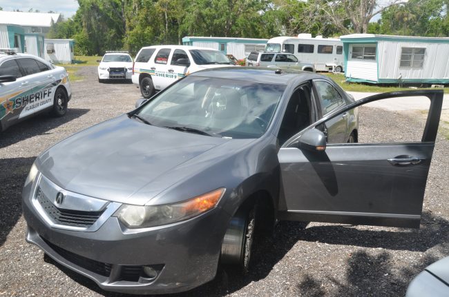 The Acura involved in the chase today, as it was being processed by deputies at the Capri trailer park. (© FlaglerLive)