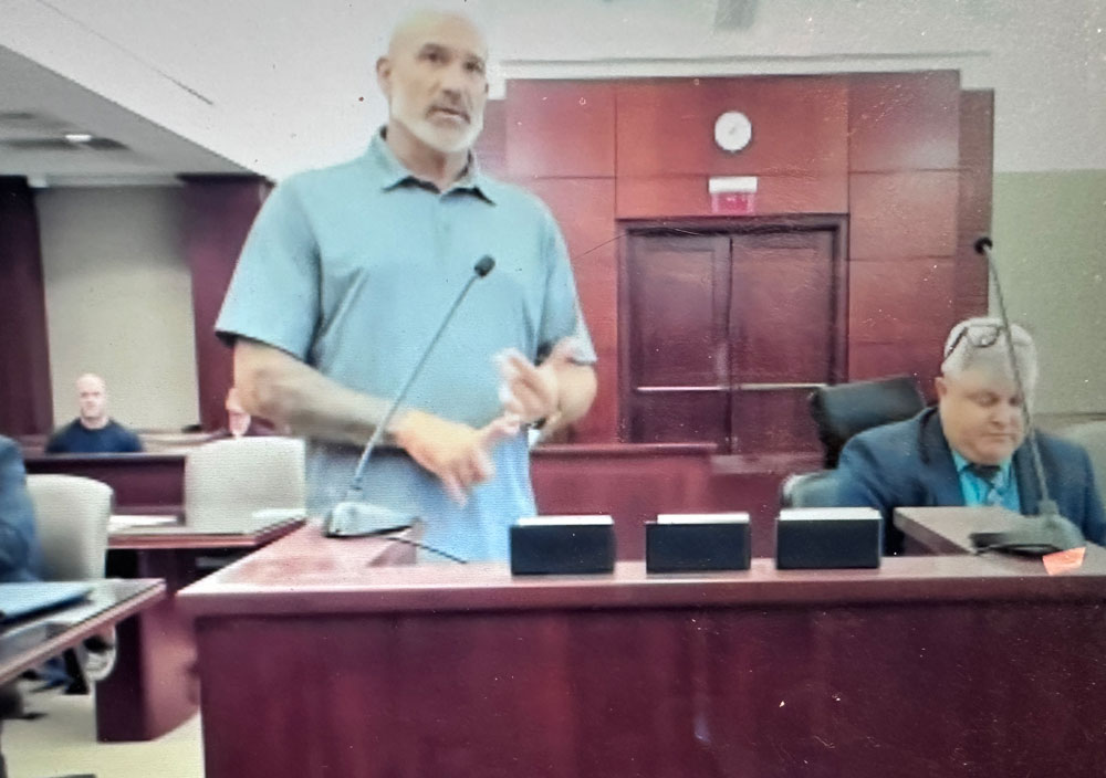 Adam Ford, left, with his attorney, Scott Westbrook. (© FlaglerLive via zoom)