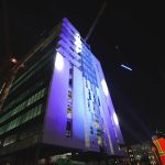 A steel beam was hoisted into place at the highest point of the building, where it was placed above a 22-foot-tall Christmas tree. (AdventHealth)