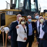 AdventHealth's top executives after filming today at the 11-acre site oif the new, $145 million hospital and medical office building on Palm Coast Parkway. From right, AdventHealth Palm Coast COO Wally de Aquino, Central Region CEO David Ottati, AdventHealth Palm Coast CEO Ron Jimenez, Chief Nursing Officer Kathy Gover, and Chief Financial Officer Mark Rathburn. (© FlaglerLive)
