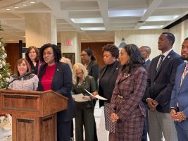 House Democratic Leader Fentrice Driskell stands among the bicameral Democratic caucus, setting forward its agenda for the 2026 legislative session on Dec. 8, 2025. (Photo by Jay Waagmeester/Florida Phoenix)