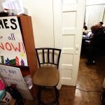 Community organizers speak in a vacant house in West Oakland, Calif., that they occupied in 2019 and 2020 to bring attention to affordable housing.