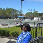 Agnes Lightfoot, long an advocate of the Palm Coast Tennis Center, was on her home grounds this morning soon after attending a City Council workshop where plans for a vast expansion of the center were unveiled. (© FlaglerLive)