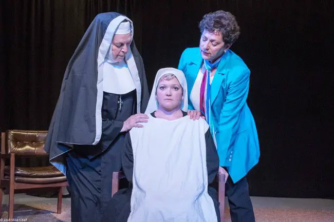 The death of a newborn baby at a convent spurs a battle of wills – and faith – in the City Repertory Theatre production of “Agnes of God.” The play stars, from left: Nancy Howell as the Mother Superior, Chelsea Jo Conard as Sister Agnes and Julia Davidson Truilo as the psychiatrist Martha Livingston. The play runs May 4-13 at City Rep’s venue in Palm Coast. (Mike Kitaif)