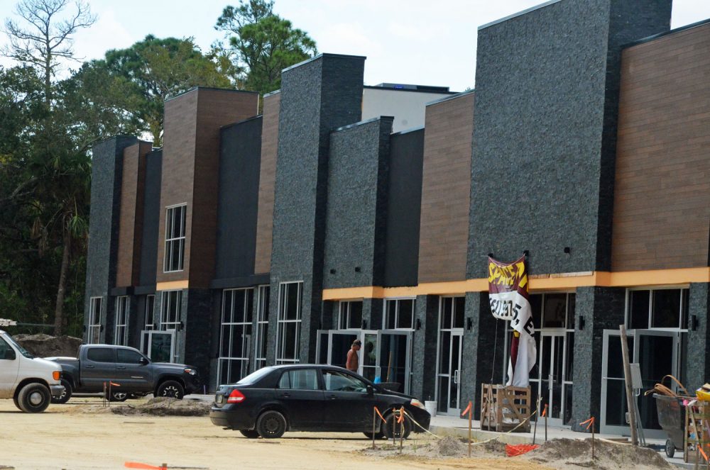 Airport Commons under construction this week. It sits at the edge of the county airport's property, opposite Wawa, along State Road 100. Its first businesses are set to open at the end of September or early October. (© FlaglerLive)