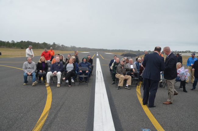 Just before the ribbon-cutting on the new runway today at the Flagler Airport, with Roy Sieger and County Commissioner Greg Hansen in the foreground, to the right. Click on the image for larger view. (© FlaglerLive)