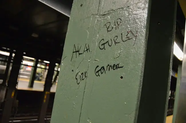 An impromptu memorial in the New York subway for Akai Gurley, killed by police in Brooklyn in November, and for Eric Garner,  killed in July on Staten Island. The officer responsible for Akai's killing was indicted on a manslaughter and other charges. The officer who killed Garner was not.  (Lauren Giaccone)
