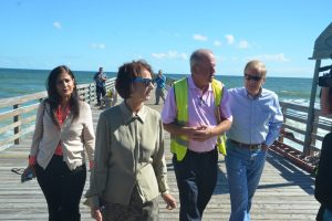 County Engineer Faith al-Khatib, left, with County Commission Chairman Barbara Revels, Flagler Beach City Manager Larry Newsom, and U.S. Sen. Bill Nelson, this morning on the Flagler Beach pier. Click on the image for larger view. (© FlaglerLive)