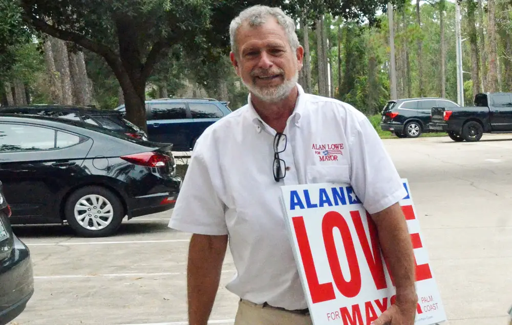 Alan Lowe, a candidate for Palm Coast mayor, at the end of the second day of early voting at the public library in Palm Coast today. (© FlaglerLive)