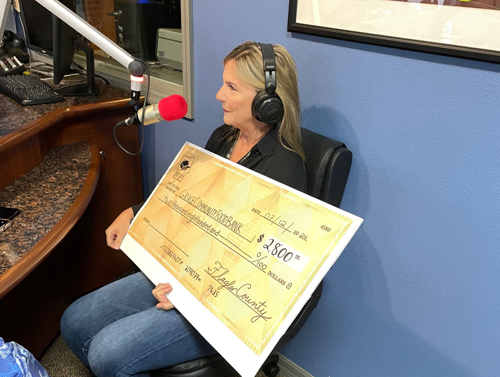Holly Albanese dropped off a $2,500 contribution from Flagler County government last year. (WNZF)