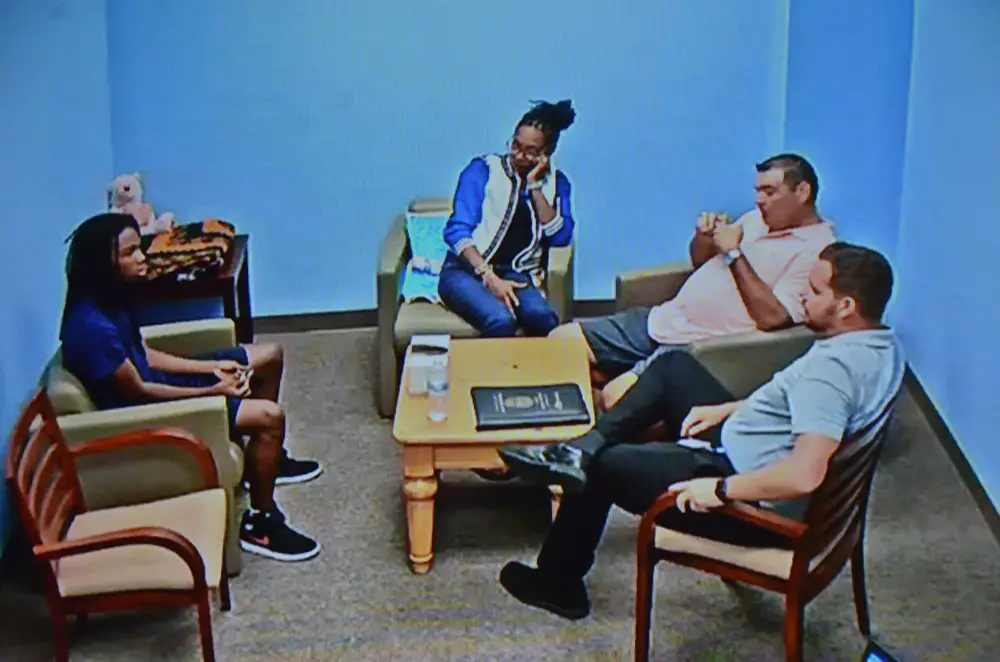 Benjamin Allen, left, in his interview with Jorge Fuentes, the lead detective in the case, in the presence of Allen's parents, from a 56-minute video shown the jury today. (© FlaglerLive)