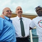 Seth Penalver, left, was on death row for almost 19 years before his exoneration and release in 2013. Herman Lindsay, right, was exonerated several years ago before Penalver. They are seen here with Mark Elliott, who heads Floridians for Alternatives to the Death penalty. (© FlaglerLive)