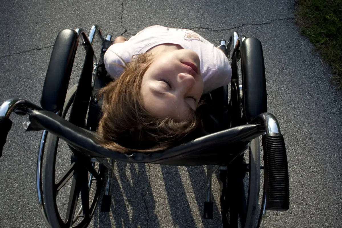 'Let the Sun Shine Down On Me,' Alyssa in her wheelchair, one of the photographs by Jennifer Kaczmarek in the latest Hollingsworth Gallery exhibit, opening Saturday. Click on the image for larger view. (© Jennifer Kaczmarek)