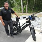 County Commission Chair Andy Dance, who also chairs the Community Traffic Safety Team, seen here with one of his ebikes, helped shape the ebike ordinance the Palm Coast City Council is crafting. (© FlaglerLive)