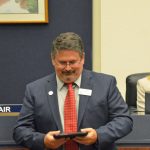 Andy Dance last fall, accepting a plaque from his colleagues recognizing his service on the School Board since 2008. He may be wistful for the "process" he was familiar with on that board. (© FlaglerLive)