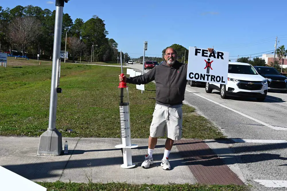 One of Palm Coast's more notorious anti-vaxxers at the county airport last year, where the Health Department was conducting vaccination clinics. (© FlaglerLive)