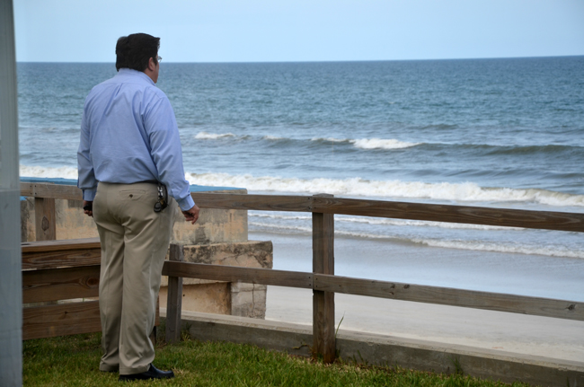 Armando and the sea: Bunnell City Manager Armando Martinez on the porch of the Beverly Beach City Hall last week, before a meeting of the Coalition of Cities, which he chairs. (© FlaglerLive)