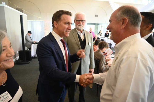 State Attorney Dave Aronberg meeting Sheriff Rick Staly before his talk. (© FlaglerLive)